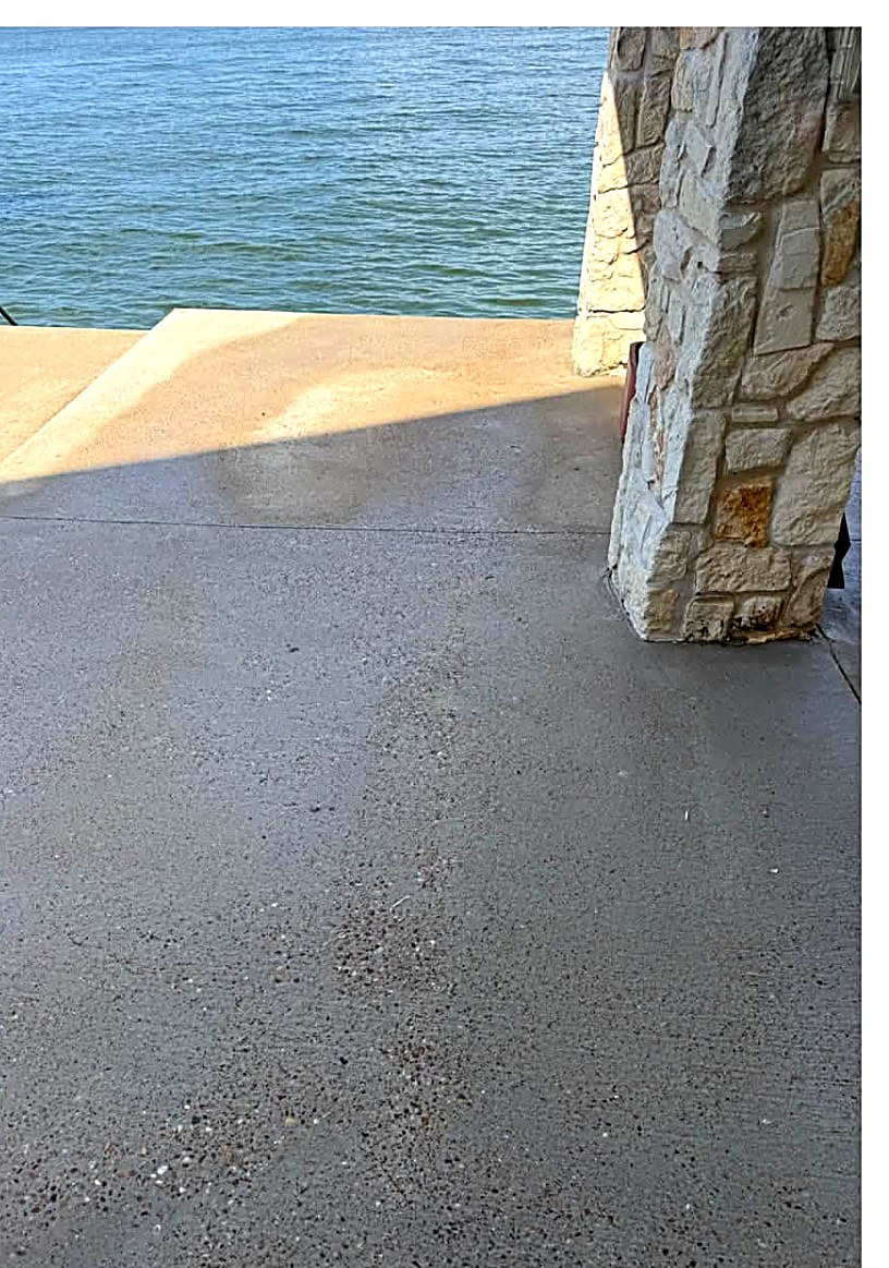 Lakeside concrete patio cleaned to an even gray finish